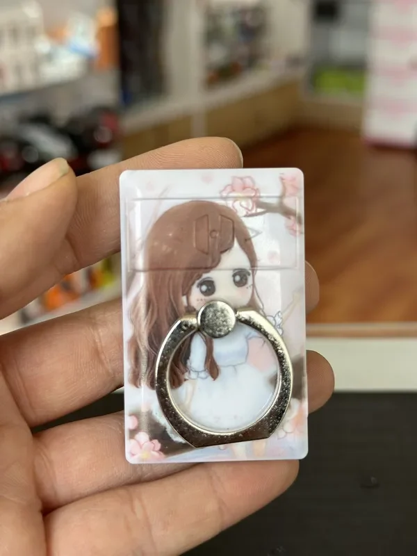 Anillo para celular con encendedor electrico